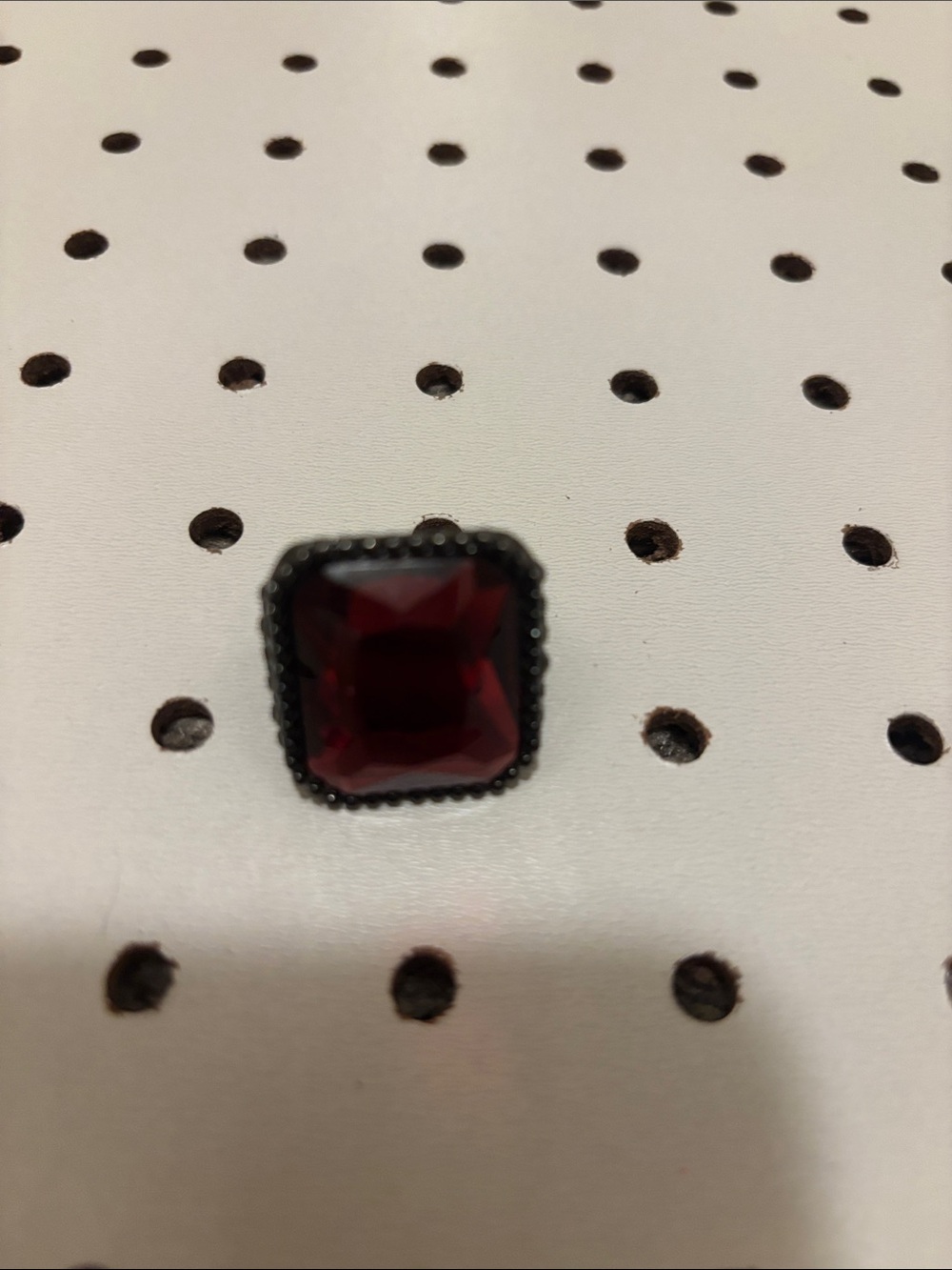 Elegant Red Gemstone Ring with Sparkling Accents